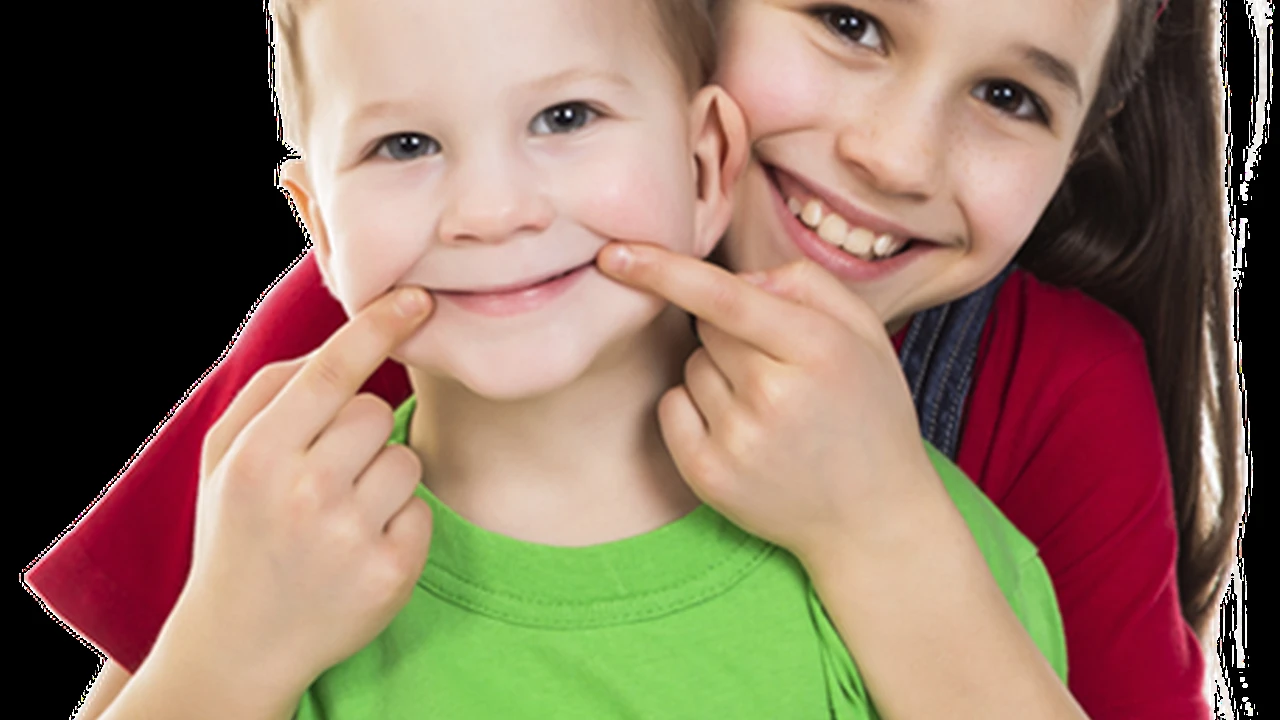 blue bowl of black bean beef tortilla soup on a board with cilantro and shredded cheese in background
